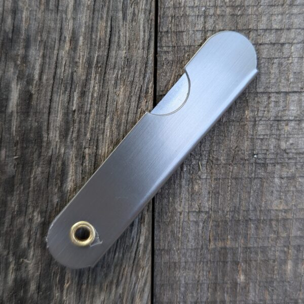 Razor knife closed on wood