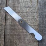 Razor knife on wood