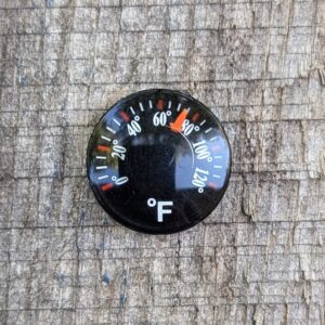 mini thermometer on wood