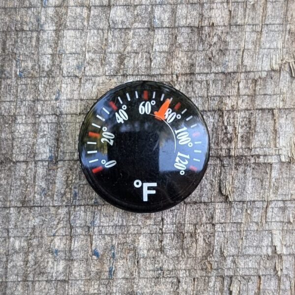 mini thermometer on wood